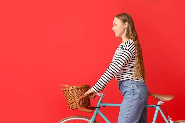 Pretty Teenage Girl Riding Bicycle Wicker Basket Red Background — Stock Photo, Image