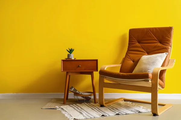 Stylish Interior Bedside Table Armchair Yellow Wall Background — Stock Photo, Image