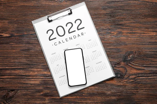 Klembord Met Papieren Kalender Voor 2022 Jaar Mobiele Telefoon Houten — Stockfoto