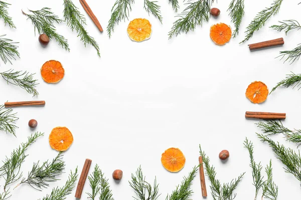 Frame Made Coniferous Branches Cinnamon Dried Orange Slices White Background — Stock Photo, Image