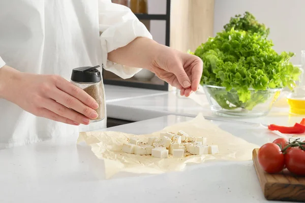 Woman Putting Spices Cut Feta Cheese Table Kitchen — Stock Photo, Image