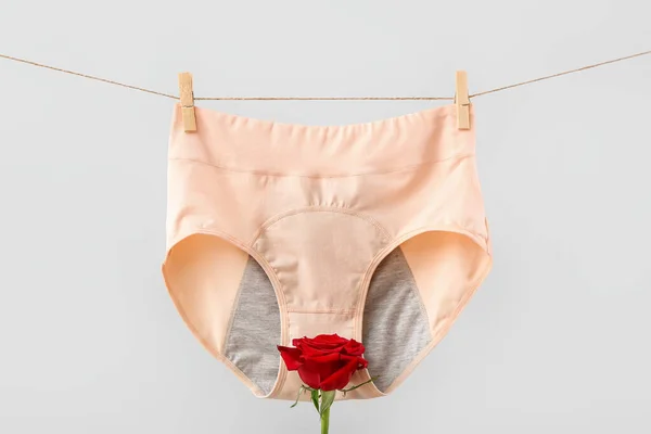 Period Panties Hanging Rope Rose Flower Grey Background — Stock Photo, Image