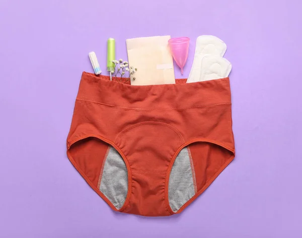 Samenstelling Met Antieke Slipjes Pads Tampons Menstruatiecup Lila Ondergrond — Stockfoto