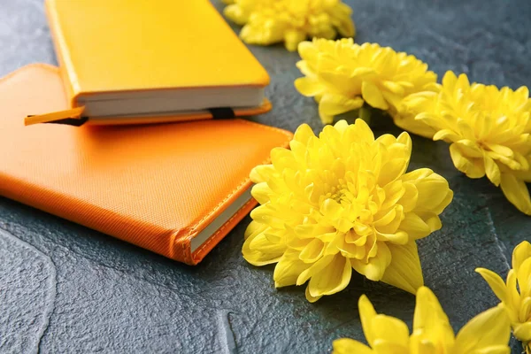 Yellow Chrysanthemum Flowers Notebooks Dark Background — Stock Photo, Image