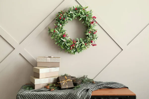 Table Gift Boxes Fir Tree Branch Christmas Wreath Hanging Light — Stock Photo, Image