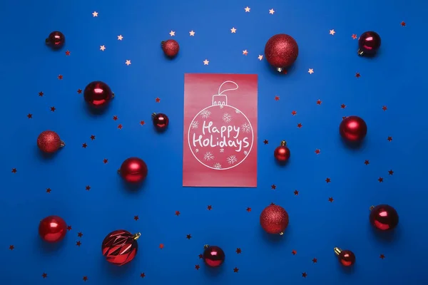 Greeting Card Text Happy Holidays Christmas Balls Confetti Blue Background — Stock Photo, Image