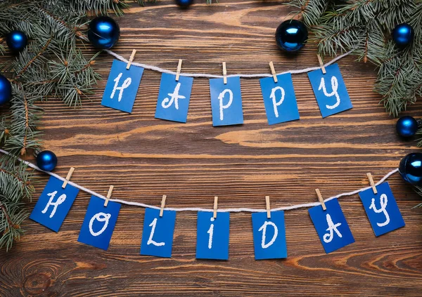 Tekst Happy Holiday Gałązki Jodły Kulki Świąteczne Drewnianym Tle — Zdjęcie stockowe