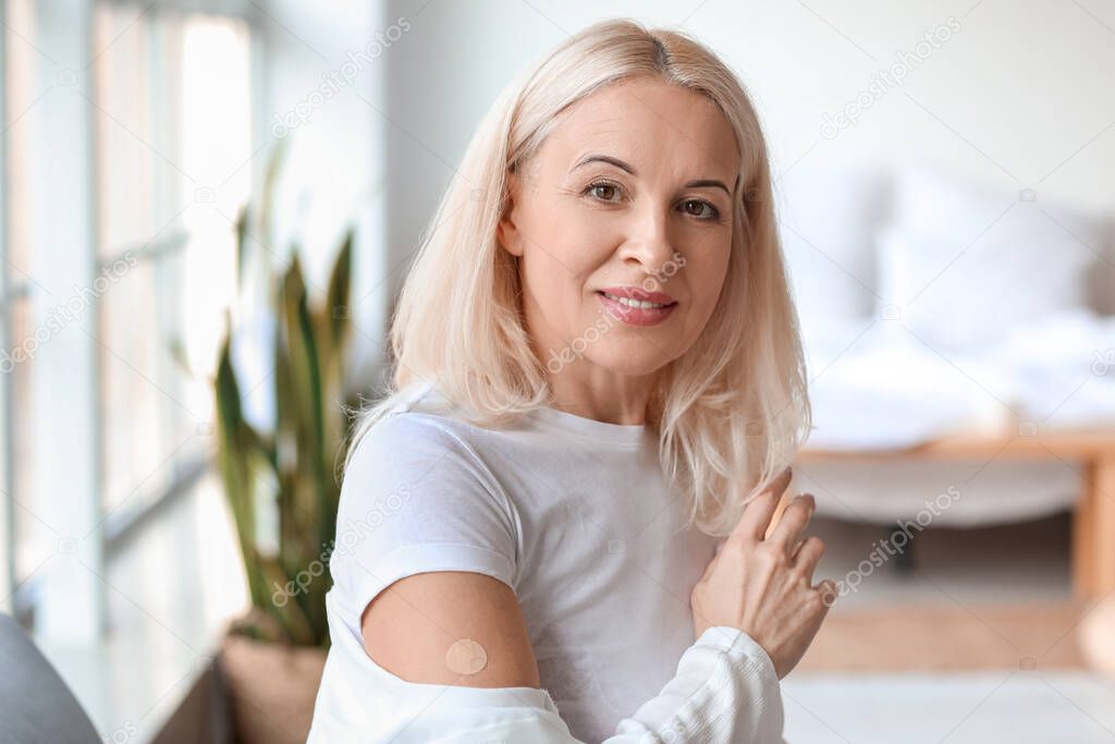 Mature woman with applied nicotine patch at home. Smoking cessation