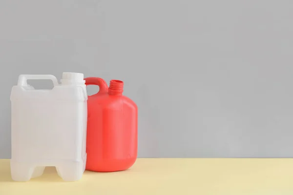 Plastic Jerrycans Grey Background — Stock Photo, Image