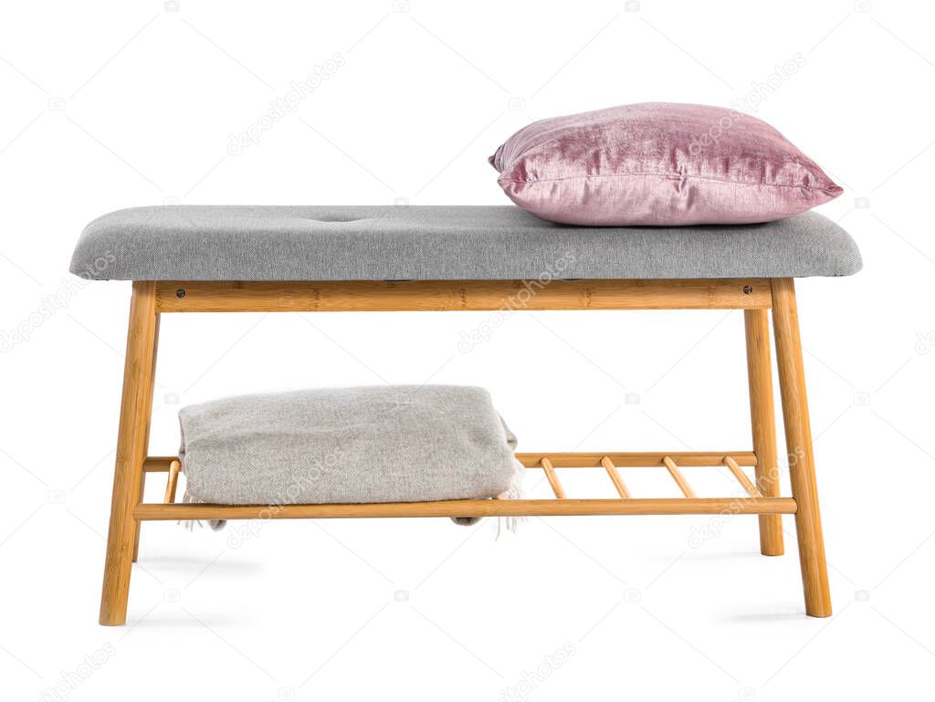 Soft bench with pillow and plaid on white background