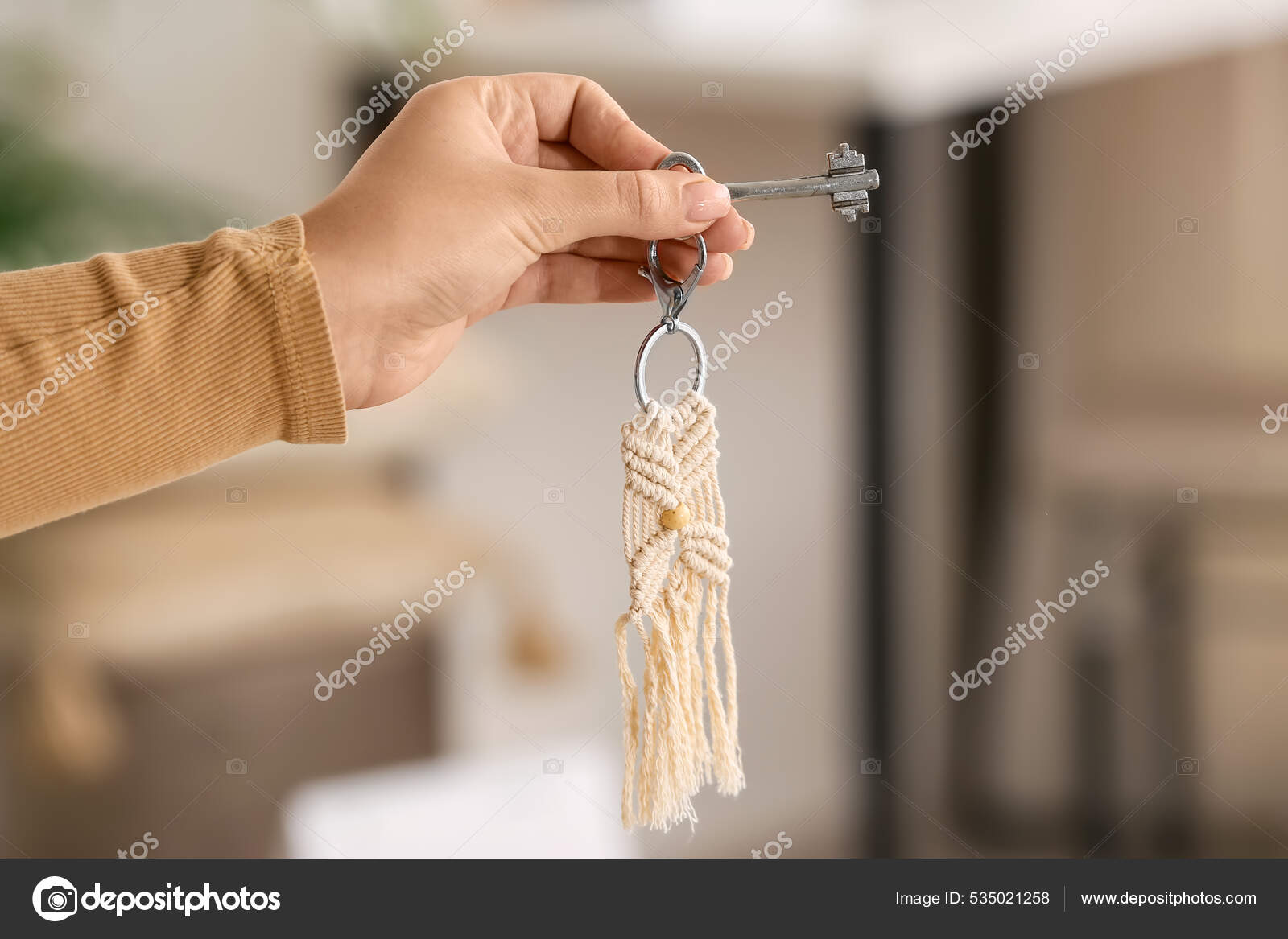 Female Hand Holding Key Chain Stock Photo by ©serezniy 535021258