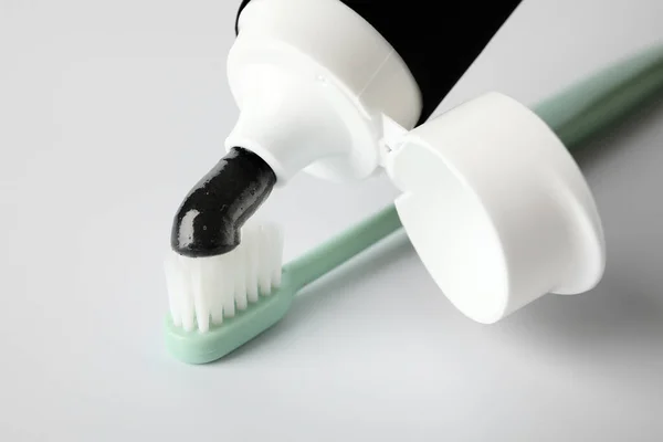 Tube Black Tooth Paste Brush White Background Closeup — Stock Photo, Image