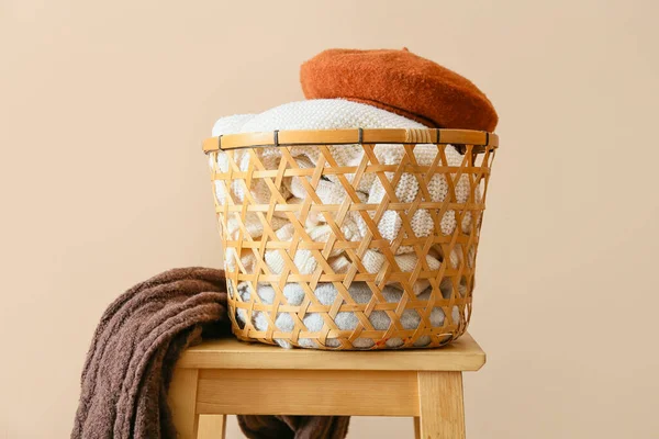Basket Stylish Winter Clothes Stool Light Background — Stock Photo, Image