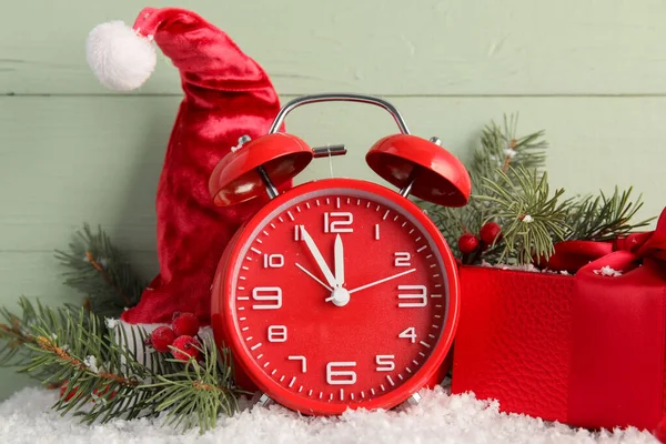 Stylish New Year Clock Christmas Decor Snow Green Wooden Background — Stock Photo, Image