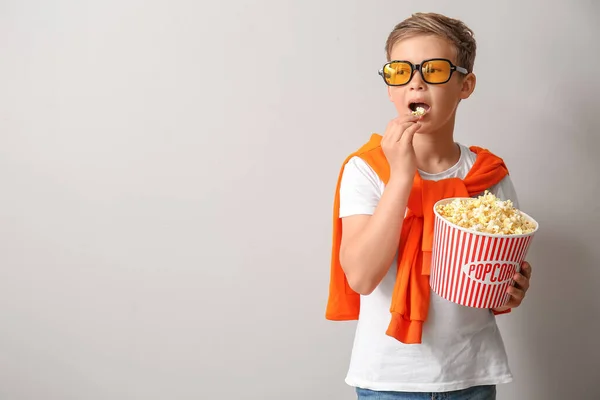 Little Boy Eyeglasses Eating Tasty Popcorn Light Background — Stock Photo, Image