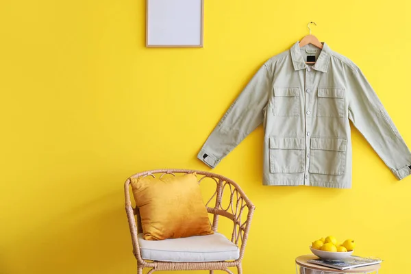 Comfortable Chair Stylish Jacket Hanging Color Wall Room — Stock Photo, Image