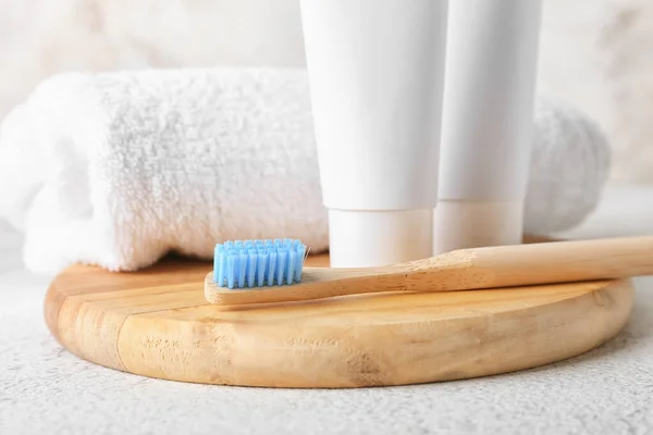 Wooden Toothbrush Pastes Towel Light Table Closeup — Stock Photo, Image