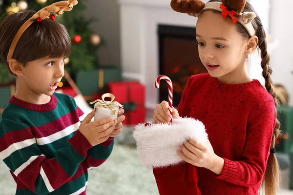 Cute Little Children Taking Gifts Out Christmas Sock Living Room — Stock Photo, Image