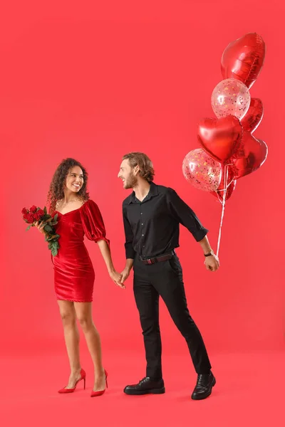 Happy Young Couple Balloons Flowers Color Background Valentine Day Celebration — Stock Photo, Image