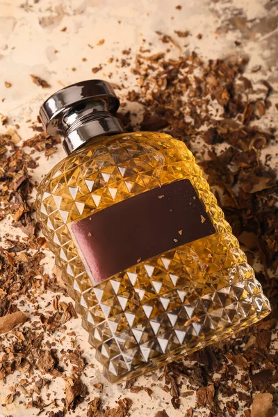 Stylish Perfume Bottle Tobacco Grunge Table — Stock Photo, Image