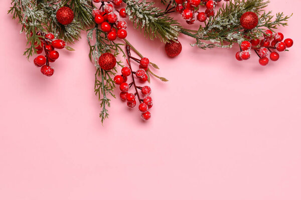 Decorated fir branch on pink background, closeup