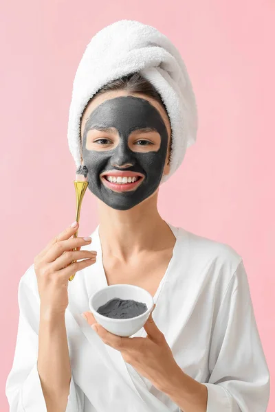 Young Woman Applying Activated Charcoal Mask Her Face Color Background — Stock Photo, Image