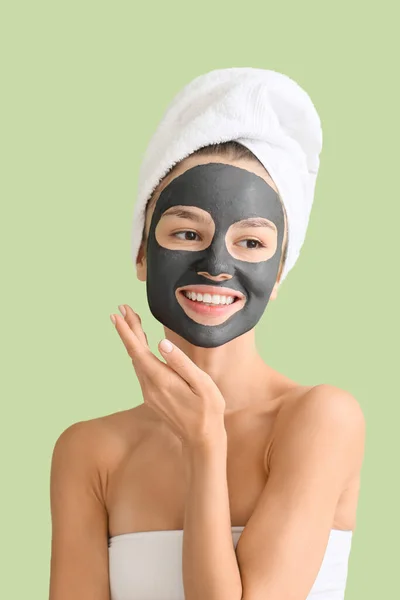 Young Woman Activated Charcoal Mask Her Face Color Background — Stock Photo, Image