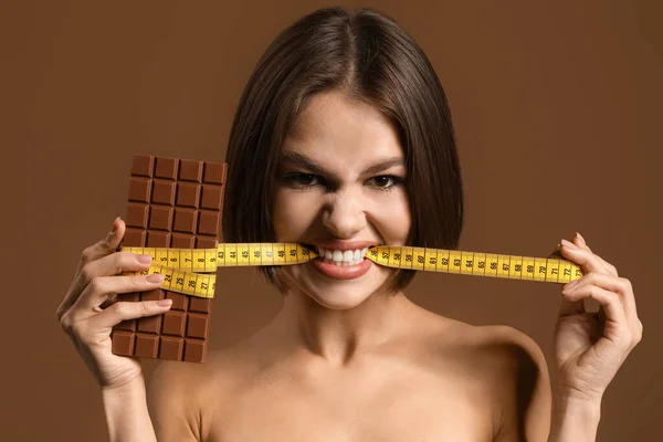 Beautiful Young Woman Sweet Chocolate Measuring Tape Color Background Diet — Stock Photo, Image