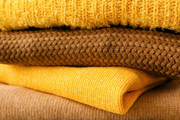 Stack Different Cozy Sweaters Grunge Background — Stock Photo, Image