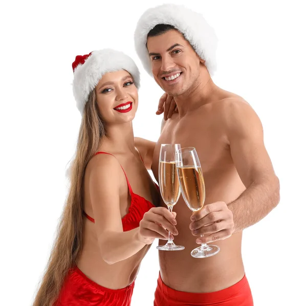 セクシー若いですカップルで下着とサンタ帽子飲むシャンパンオンホワイト背景 — ストック写真