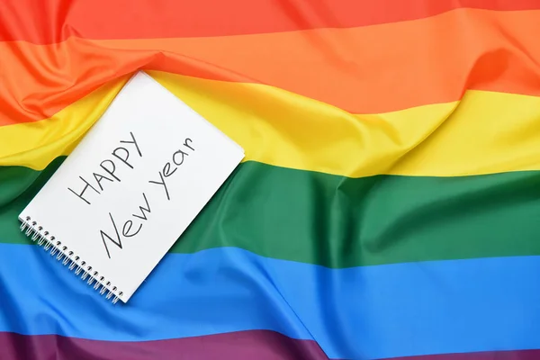 Lgbt标志上印有Happy新年字样的笔记本 — 图库照片