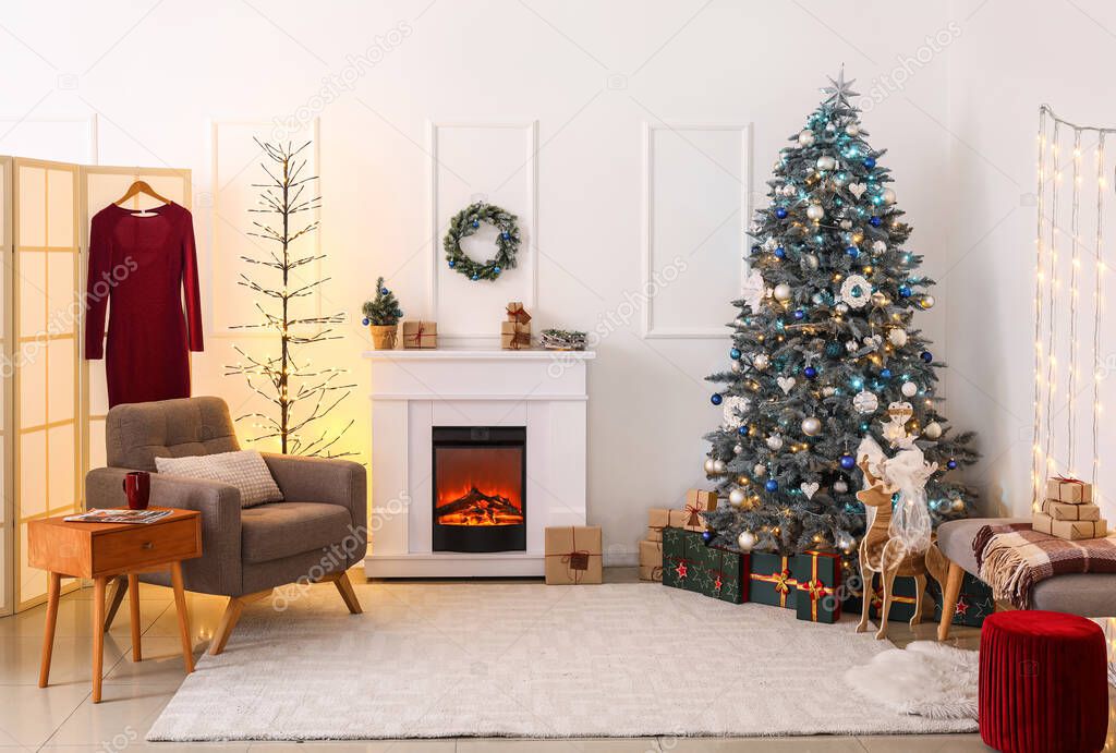 Stylish interior of living room with Christmas tree and fireplace