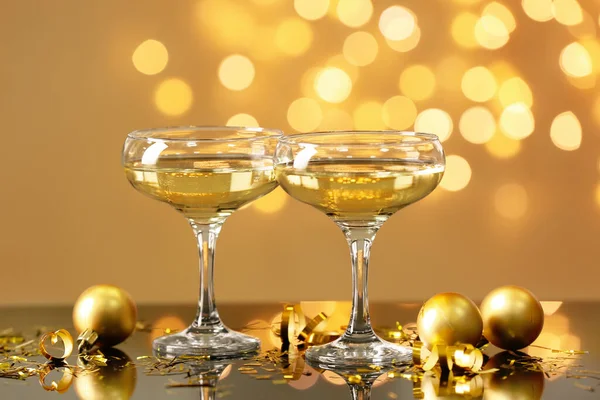 Glasses Champagne Christmas Balls Table Blurred Lights — Stock Photo, Image