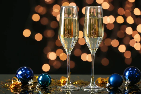 Glasses Champagne Christmas Balls Table Blurred Lights — Stock Photo, Image