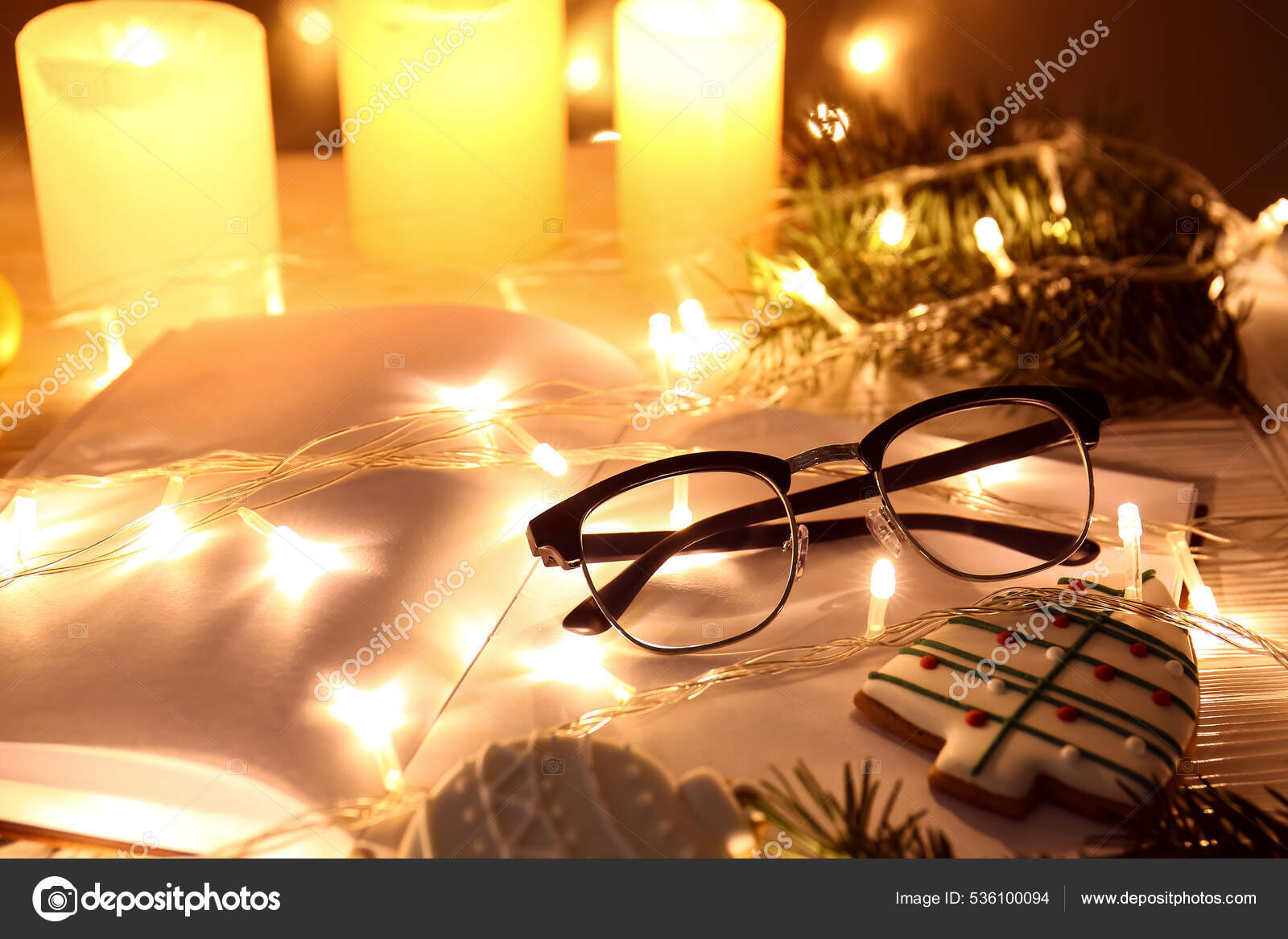 Open Book Christmas Lights Eyeglasses Cookies Table Stock Photo by