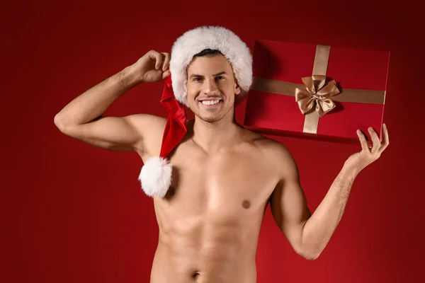 Sexy Young Man Santa Hat Christmas Gift Color Background — Stock Photo, Image