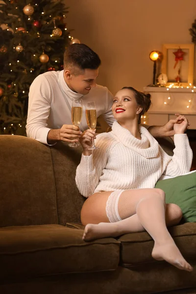 Happy Young Couple Drinking Champagne While Having Romantic Date Christmas — Stock Photo, Image