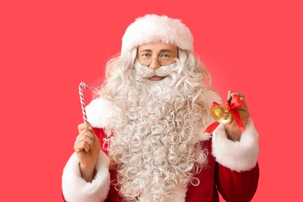 Santa Claus Con Campana Navidad Bastón Caramelo Sobre Fondo Rojo —  Fotos de Stock