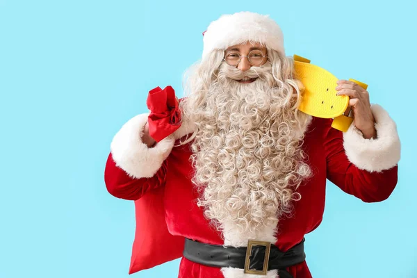 Santa Claus Red Bag Skateboard Blue Background — Stock Photo, Image