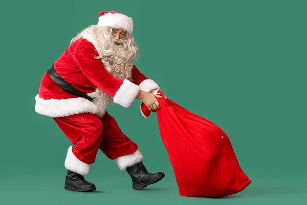 Santa Claus Heavy Bag Green Background — Stock Photo, Image