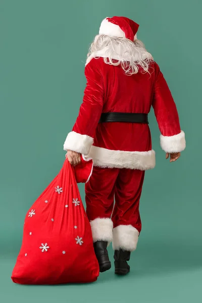 Santa Claus Červenou Taškou Zeleném Pozadí — Stock fotografie