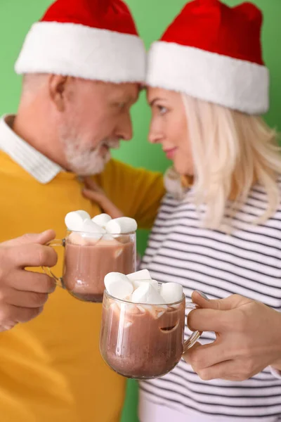 Happy Mature Couple Santa Hats Hot Chocolate Color Background — Stock Photo, Image