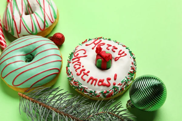 Tasty Christmas Donuts Fir Tree Branch Balls Green Background Closeup — Stock Photo, Image