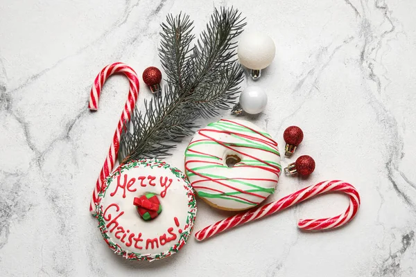 Tasty Christmas Donuts Fir Tree Branch Balls Candy Canes Light — Stock Photo, Image