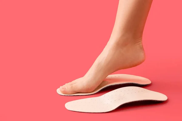 Female Foot Orthopedic Insoles Red Background — Stock Photo, Image