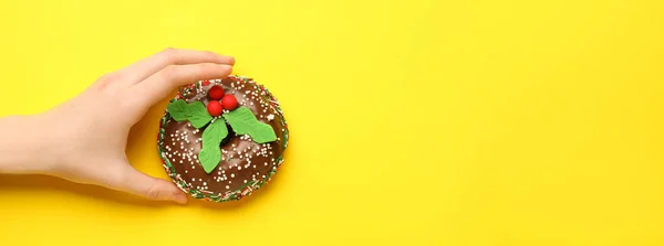 Female Hand Tasty Christmas Donut Yellow Background Space Text — Stock Photo, Image