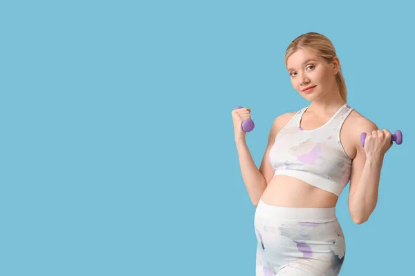 Young Pregnant Woman Dumbbells Blue Background — 图库照片