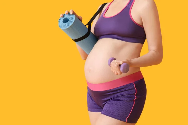 Young Pregnant Woman Dumbbell Yoga Mat Yellow Background — Stock Photo, Image