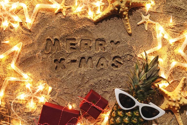 Christmas Composition Glowing Garland Wet Beach Sand — Stock Photo, Image