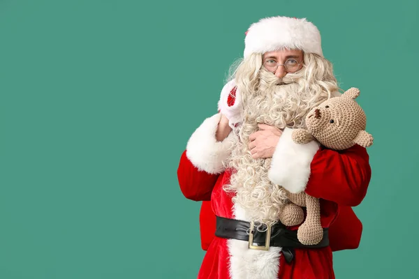 Санта Клаус Плюшевым Мишкой Мешком Зеленом Фоне — стоковое фото